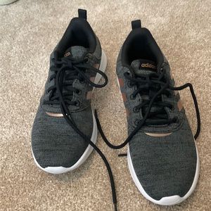 Adidas charcoal tennis shoes with gold metallic on the sides.  Size 8